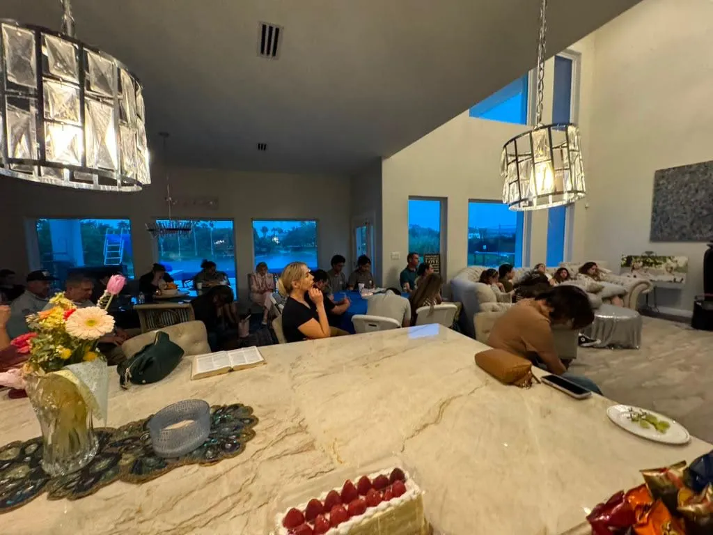 People praying together during a Ruah home gathering